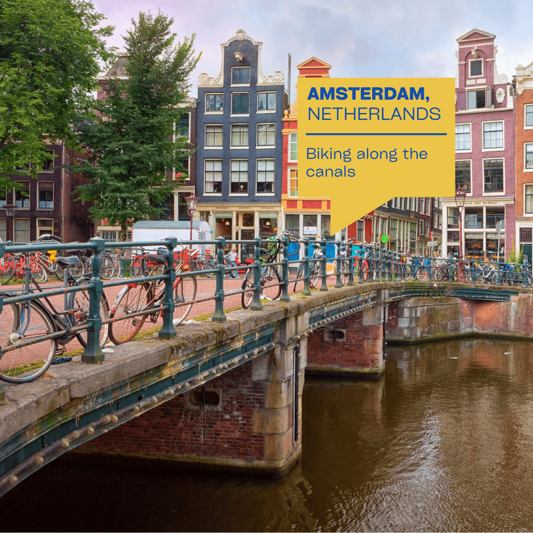 Biking along Amsterdam’s canals in the Netherlands – free and scenic activity for summer travel in Europe