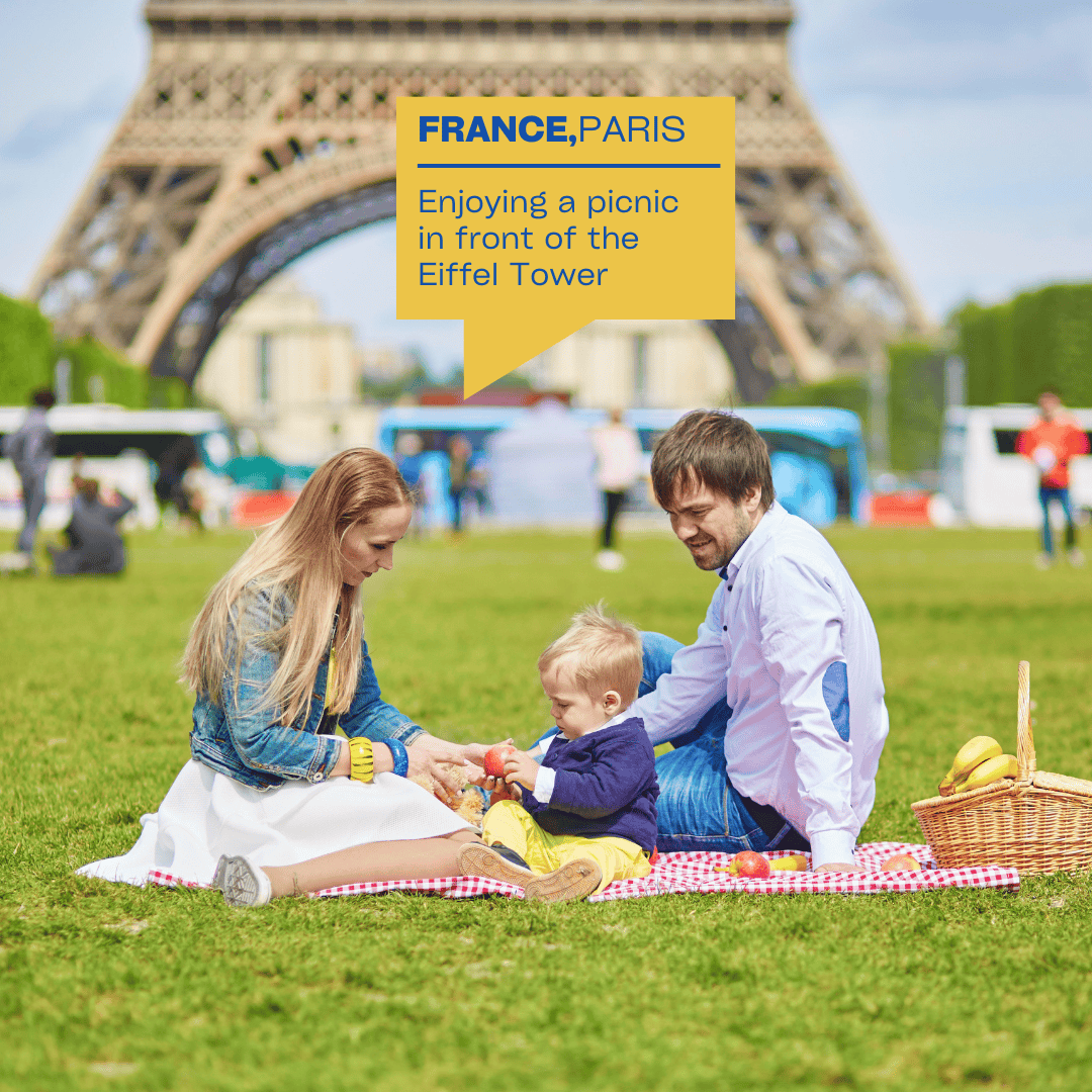 Family picnic in front of the Eiffel Tower in Paris – relaxing and free summer activity in Europe